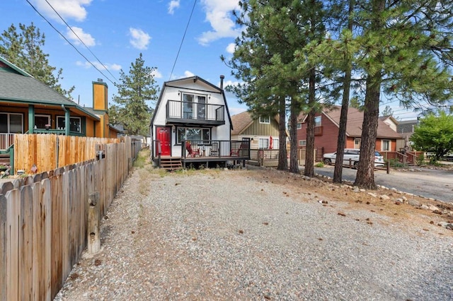 view of front of home featuring a balcony