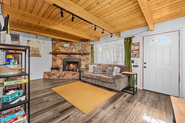 living room featuring beam ceiling, hardwood / wood-style flooring, a wealth of natural light, and wood ceiling