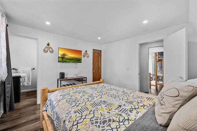 bedroom with dark wood-type flooring