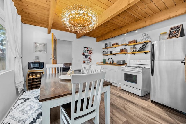 dining space with beamed ceiling, light hardwood / wood-style floors, wooden ceiling, and a notable chandelier