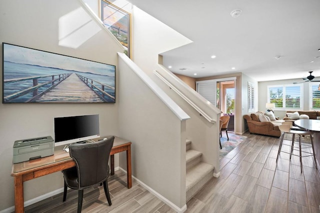 staircase with ceiling fan