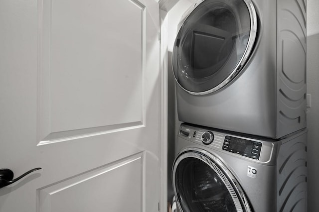 laundry room with stacked washer and clothes dryer