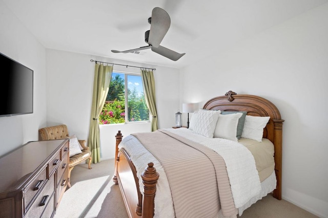 bedroom with light carpet and ceiling fan