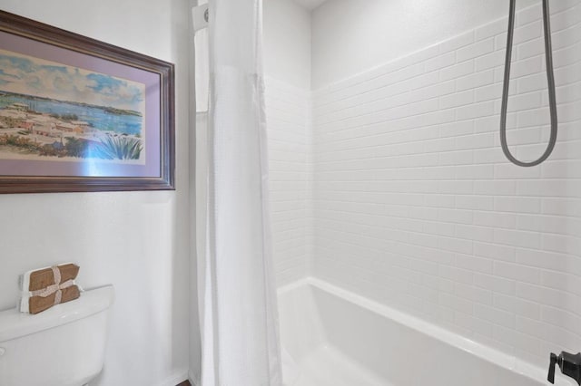 bathroom featuring shower / bathtub combination with curtain and toilet