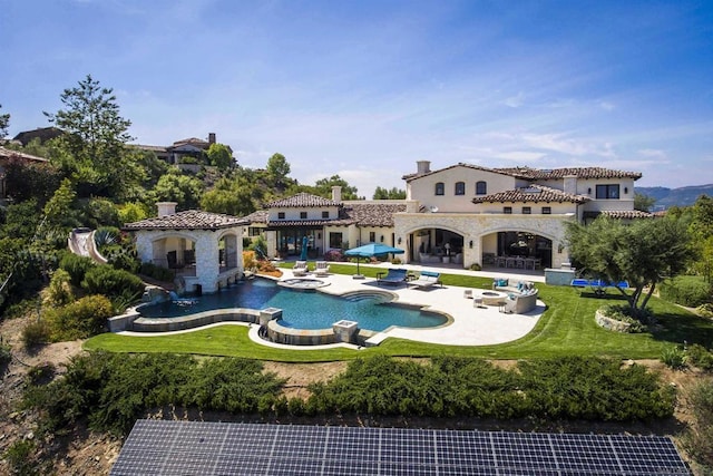 view of swimming pool featuring a yard and a patio area