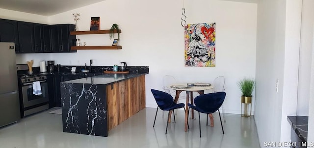 bar with sink and appliances with stainless steel finishes