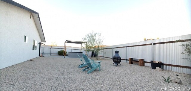 view of yard with an outdoor fire pit