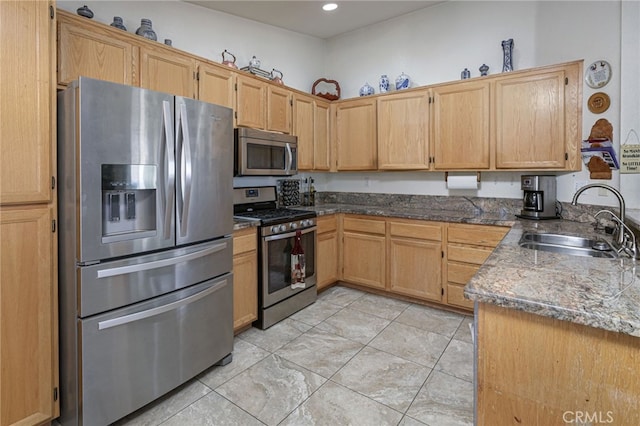 14329 Stone Creek Trl, Hesperia, CA 92344 - kitchen featuring dark stone countertops, sink, stainless steel appliances, and light tile floors