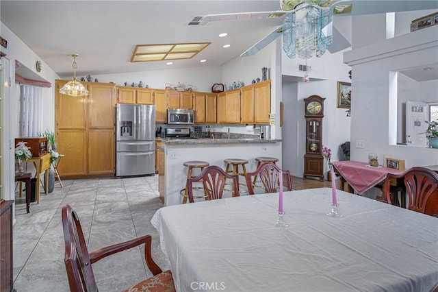 14329 Stone Creek Trl, Hesperia, CA 92344 - dining area with high vaulted ceiling, a notable chandelier, and light tile flooring