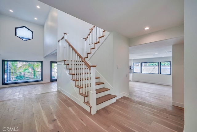 staircase featuring wood-type flooring