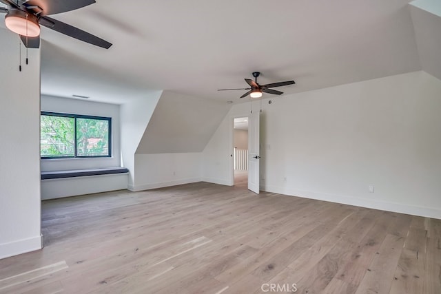 bonus room with light wood-type flooring, ceiling fan, and lofted ceiling