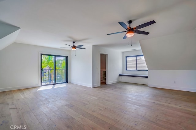 additional living space featuring plenty of natural light, ceiling fan, and light hardwood / wood-style floors