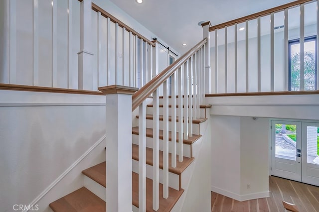 stairway featuring hardwood / wood-style floors