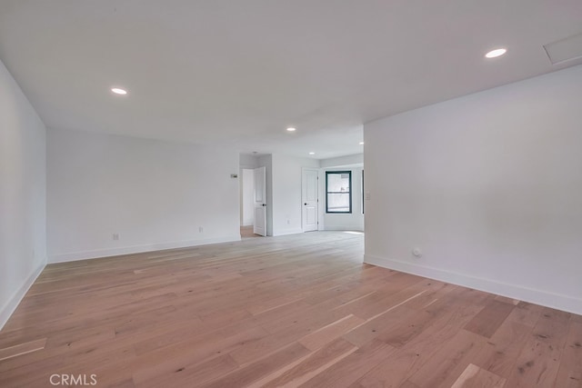 spare room with light hardwood / wood-style flooring