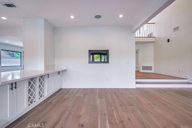 unfurnished living room featuring light hardwood / wood-style floors