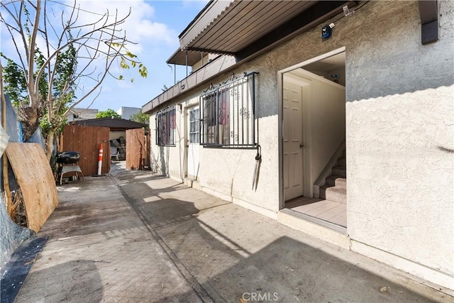 view of side of property featuring a patio