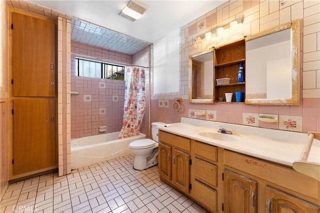 full bathroom with tasteful backsplash, shower / bath combination with curtain, toilet, vanity, and tile walls