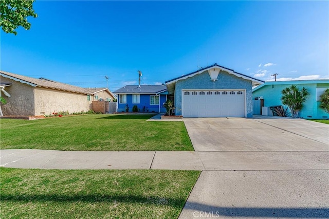 single story home featuring a garage and a front lawn