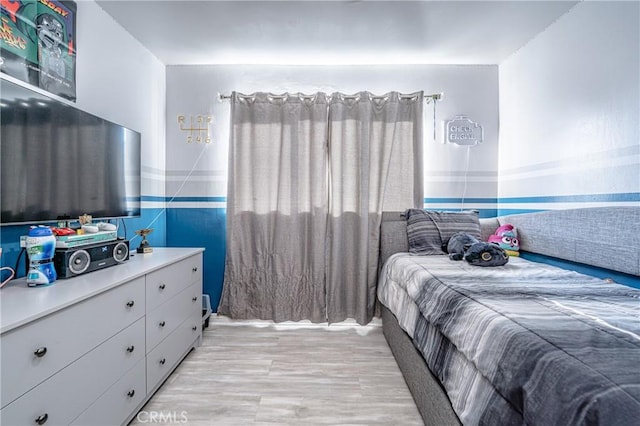 bedroom with light hardwood / wood-style floors