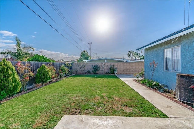 view of yard featuring central AC unit