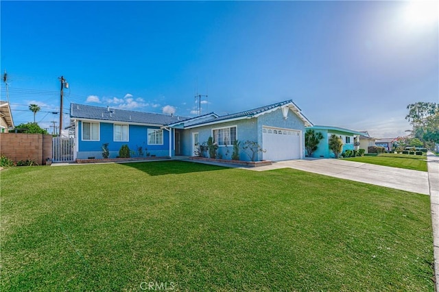 single story home featuring a garage and a front yard