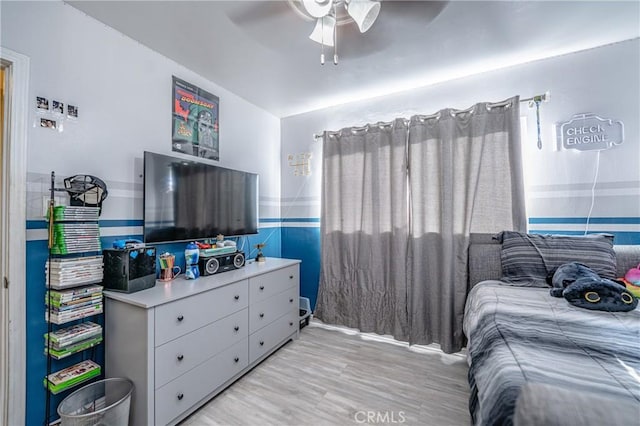 bedroom featuring ceiling fan and light hardwood / wood-style floors