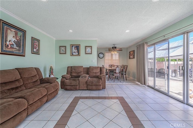 tiled living room featuring ceiling fan, crown molding, and a textured ceiling