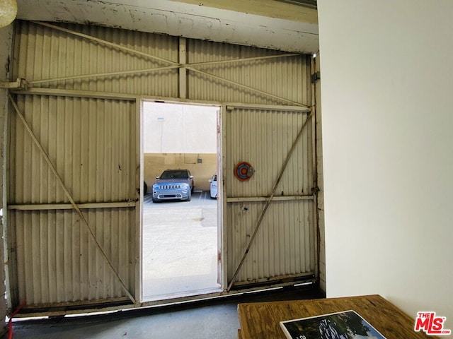 doorway to outside with concrete flooring