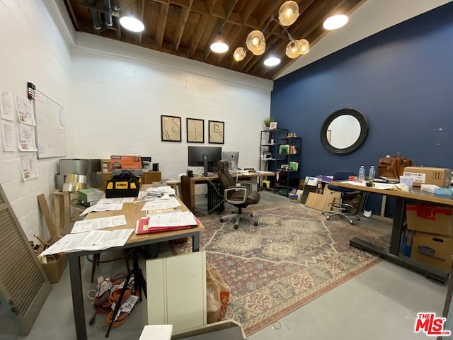 office area featuring concrete floors