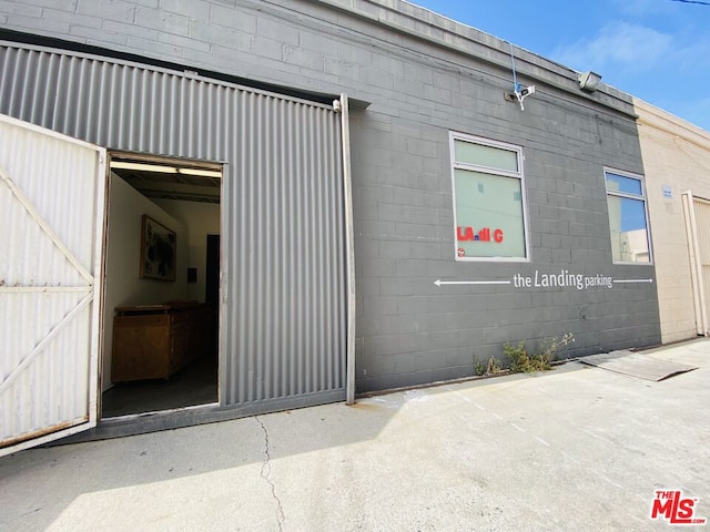 view of exterior entry with a garage