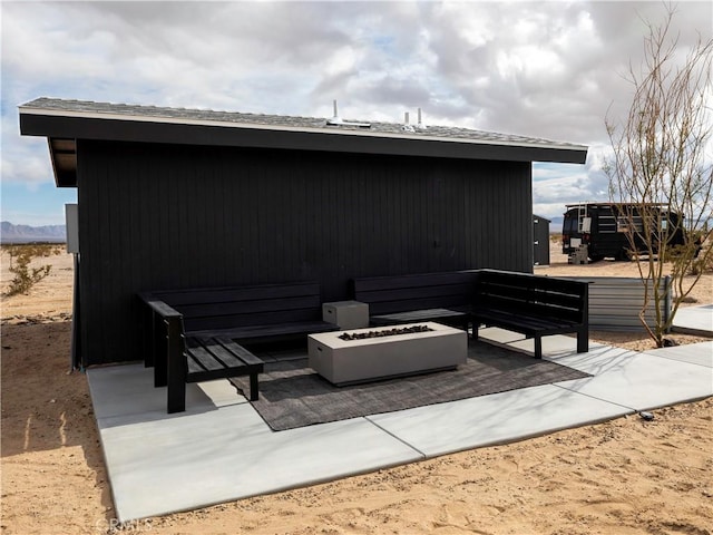 view of patio / terrace featuring an outdoor fire pit