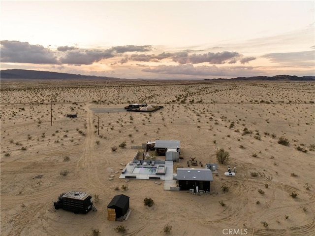 aerial view at dusk with a mountain view