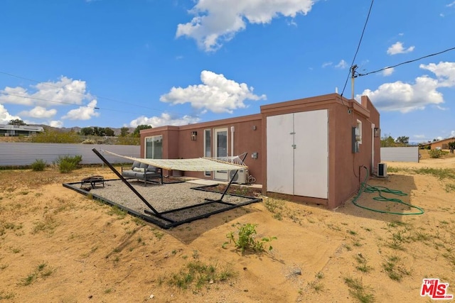 back of property featuring central air condition unit