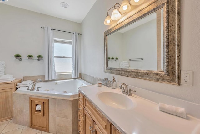 bathroom with vanity, tiled tub, and tile patterned flooring