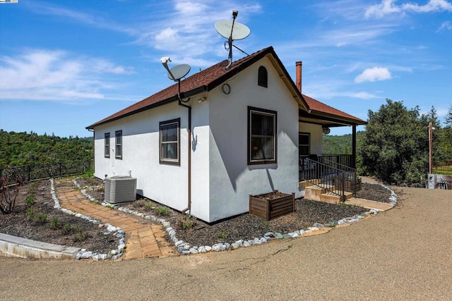 view of side of property featuring cooling unit