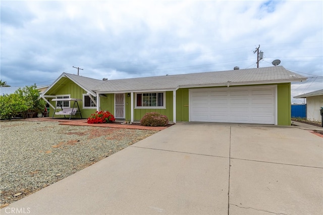 ranch-style home featuring covered porch and a garage