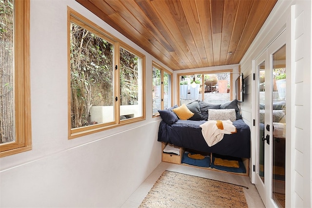 bedroom featuring french doors and wood ceiling