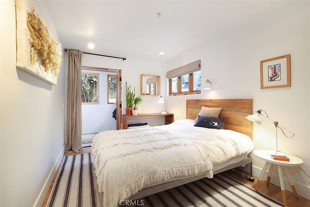 667 Glenneyre St, Laguna Beach, CA 92651 - bedroom with baseboards, wood finished floors, and recessed lighting