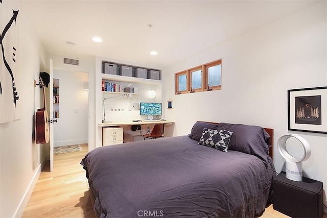 667 Glenneyre St, Laguna Beach, CA 92651 - bedroom with built in study area, baseboards, visible vents, light wood-style floors, and recessed lighting