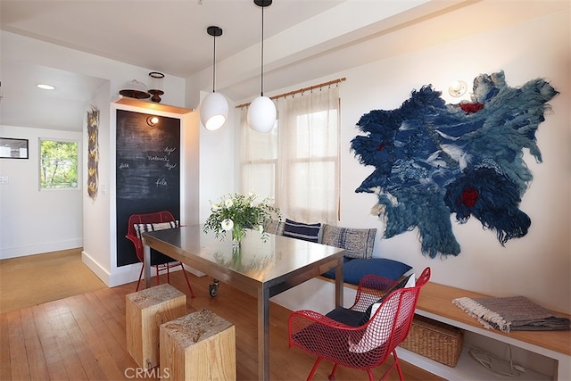 dining space featuring a wealth of natural light and hardwood / wood-style flooring