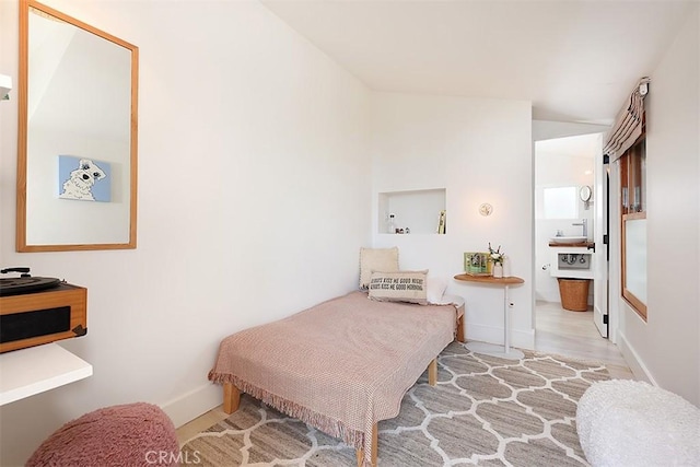 667 Glenneyre St, Laguna Beach, CA 92651 - bedroom featuring baseboards, wood finished floors, and vaulted ceiling