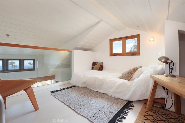 bedroom featuring lofted ceiling with beams