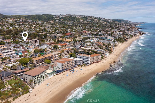 bird's eye view featuring a water view and a view of the beach