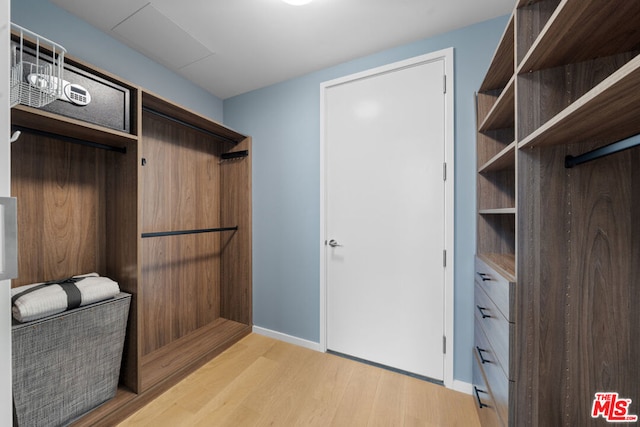 walk in closet featuring light wood-type flooring