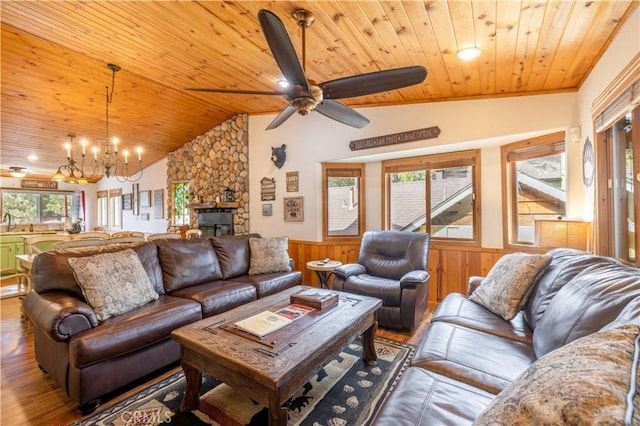 living room featuring a healthy amount of sunlight, wood ceiling, wood walls, and wood-type flooring