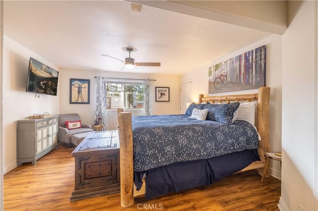 bedroom with light hardwood / wood-style flooring and ceiling fan