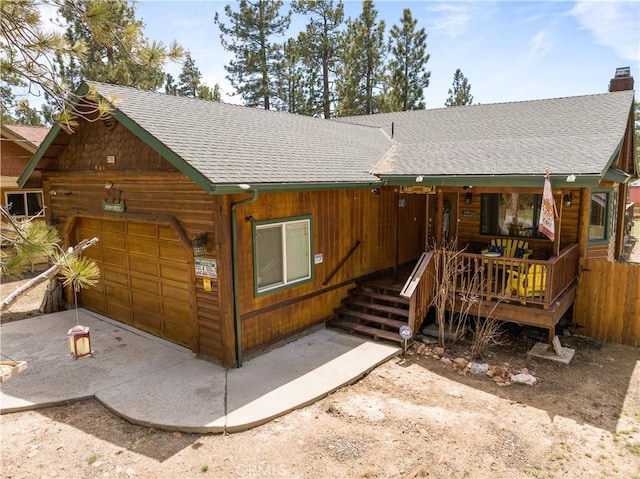 view of front of home with a garage and covered porch