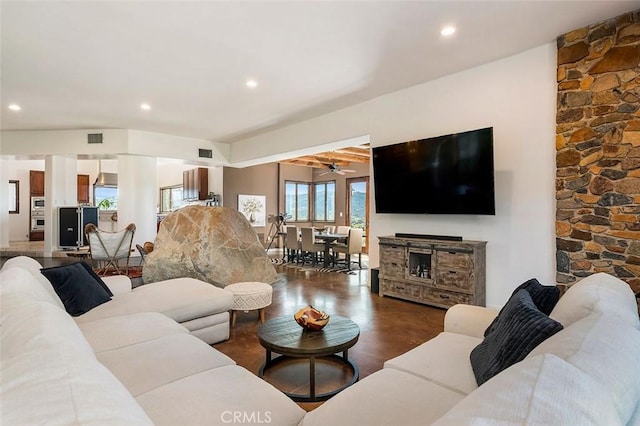 living room with dark hardwood / wood-style flooring and ceiling fan