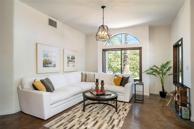 living room featuring a notable chandelier