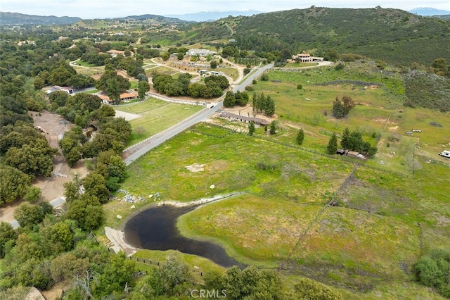 drone / aerial view featuring a mountain view